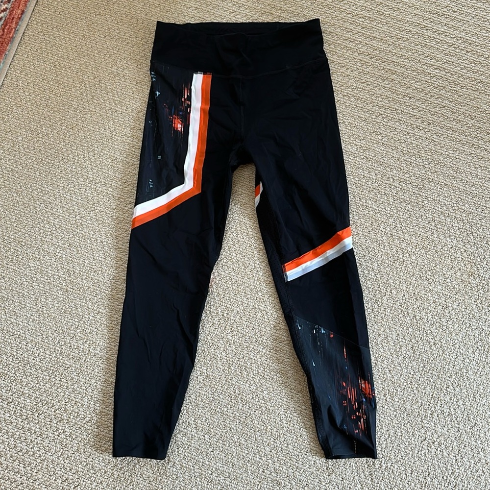 Sweaty Betty Black Leggings with Orange and White Stripe Accents